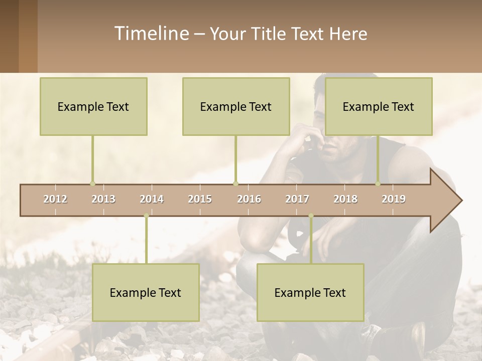 A Man Sitting On A Train Track Talking On A Cell Phone PowerPoint Template