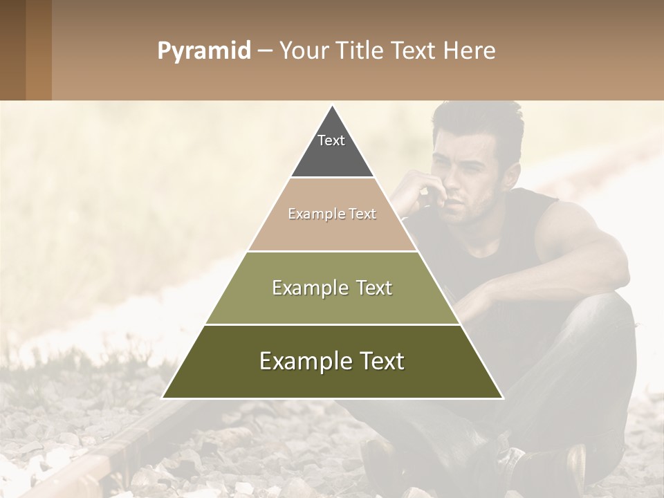 A Man Sitting On A Train Track Talking On A Cell Phone PowerPoint Template
