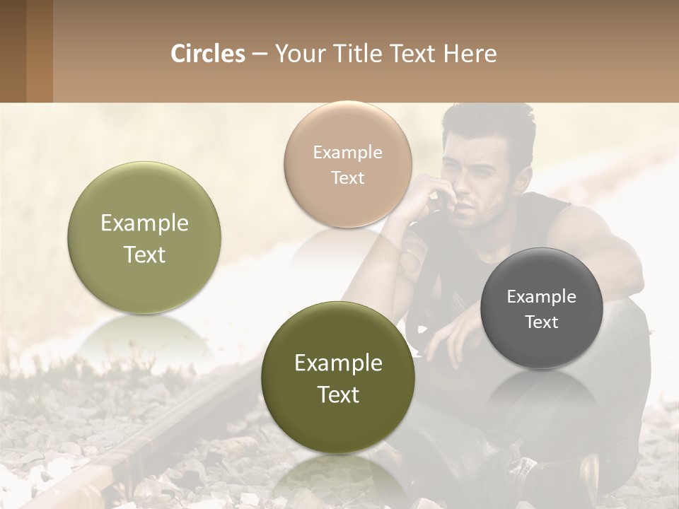 A Man Sitting On A Train Track Talking On A Cell Phone PowerPoint Template