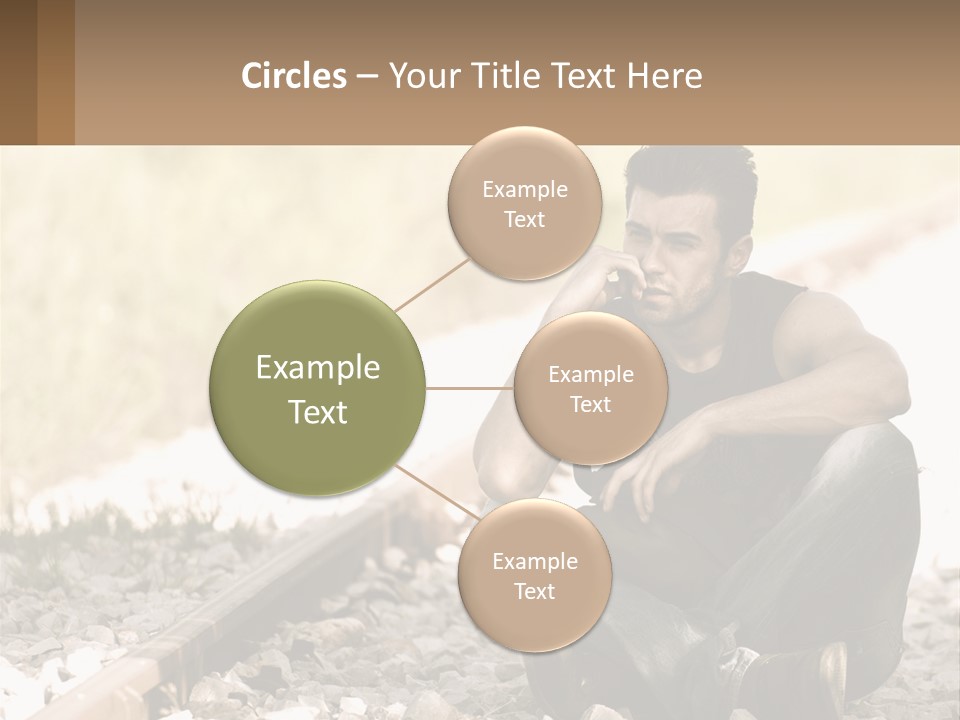 A Man Sitting On A Train Track Talking On A Cell Phone PowerPoint Template