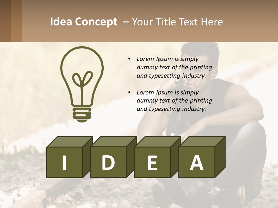 A Man Sitting On A Train Track Talking On A Cell Phone PowerPoint Template