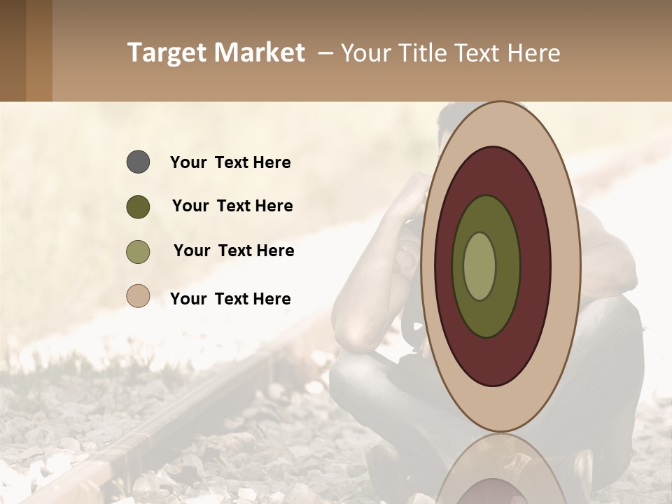 A Man Sitting On A Train Track Talking On A Cell Phone PowerPoint Template