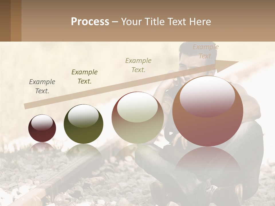 A Man Sitting On A Train Track Talking On A Cell Phone PowerPoint Template