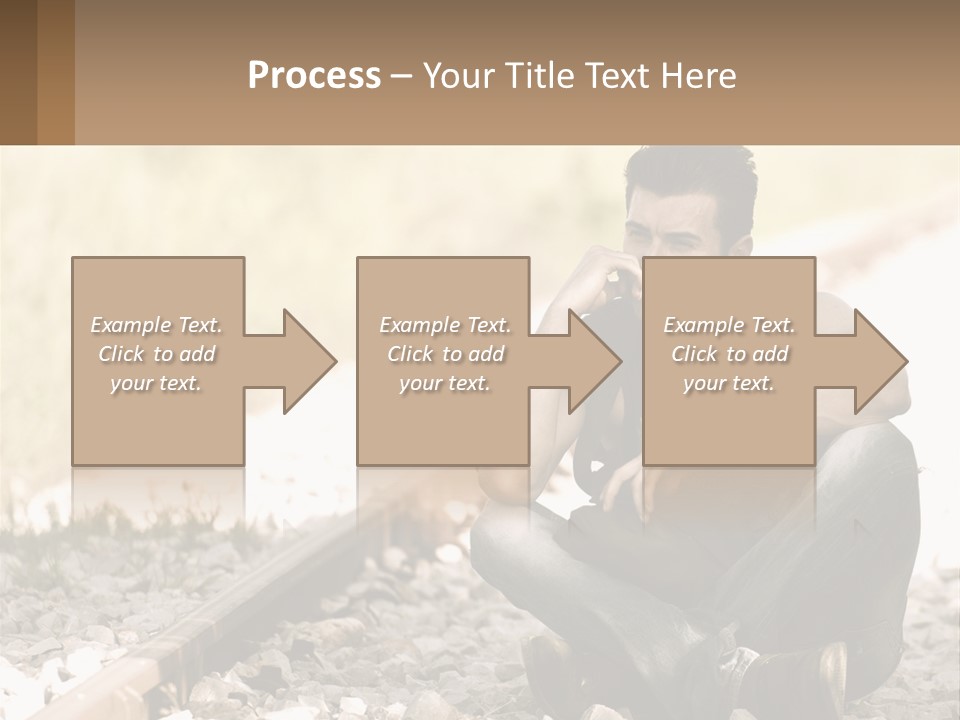 A Man Sitting On A Train Track Talking On A Cell Phone PowerPoint Template
