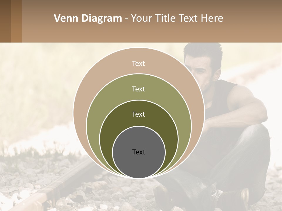A Man Sitting On A Train Track Talking On A Cell Phone PowerPoint Template