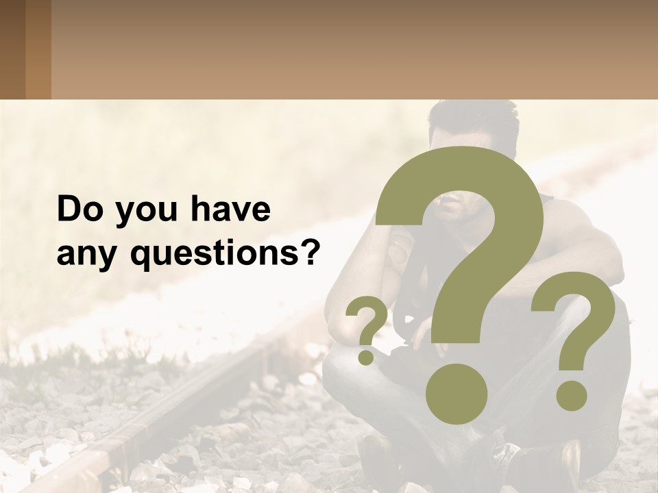 A Man Sitting On A Train Track Talking On A Cell Phone PowerPoint Template