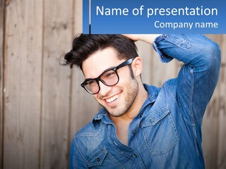 A Man Wearing Glasses And A Denim Shirt PowerPoint Template