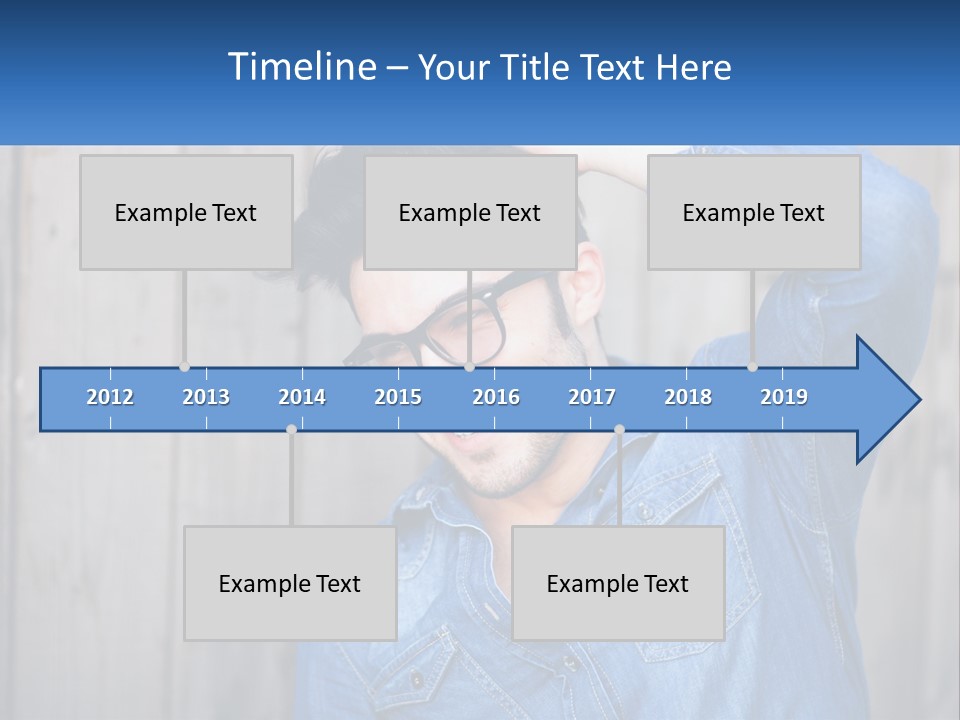 A Man Wearing Glasses And A Denim Shirt PowerPoint Template