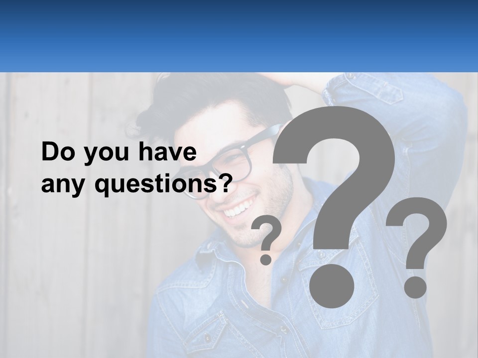 A Man Wearing Glasses And A Denim Shirt PowerPoint Template