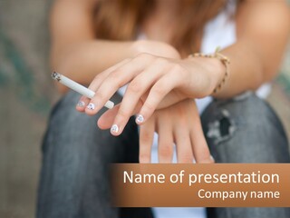 A Woman Holding A Cigarette In Her Hand PowerPoint Template