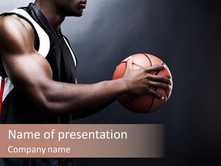 A Man Holding A Basketball In His Hand PowerPoint Template