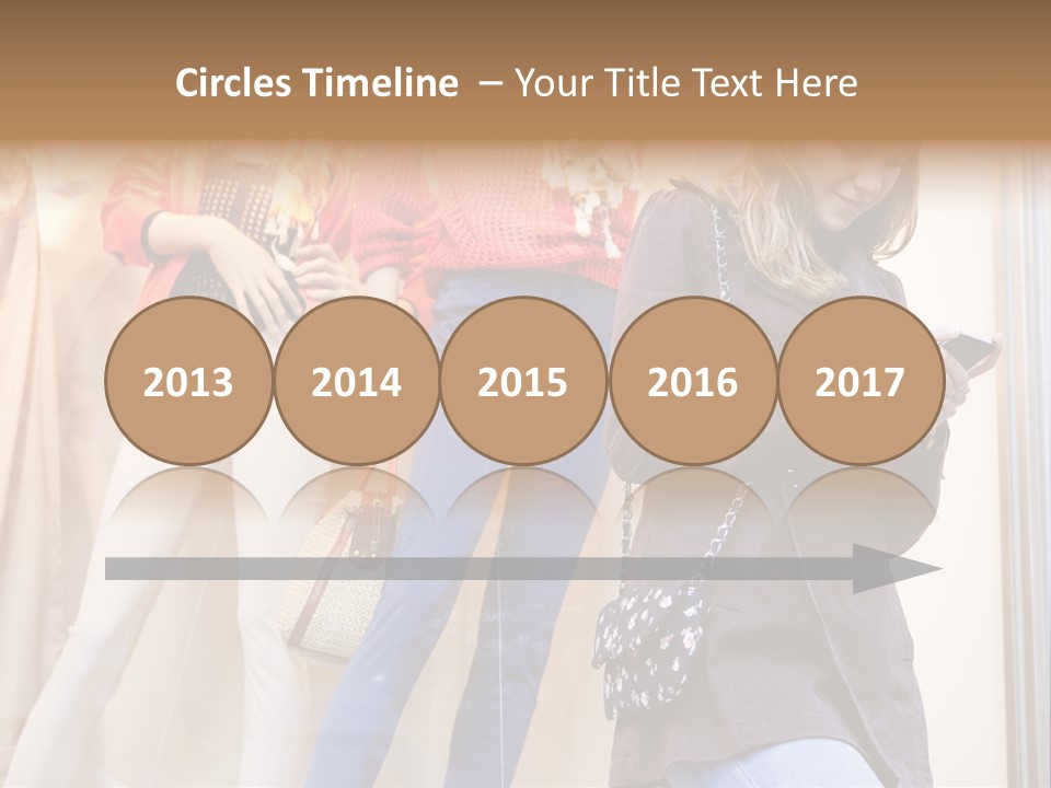 A Woman Looking At Her Cell Phone In Front Of Mannequins PowerPoint Template