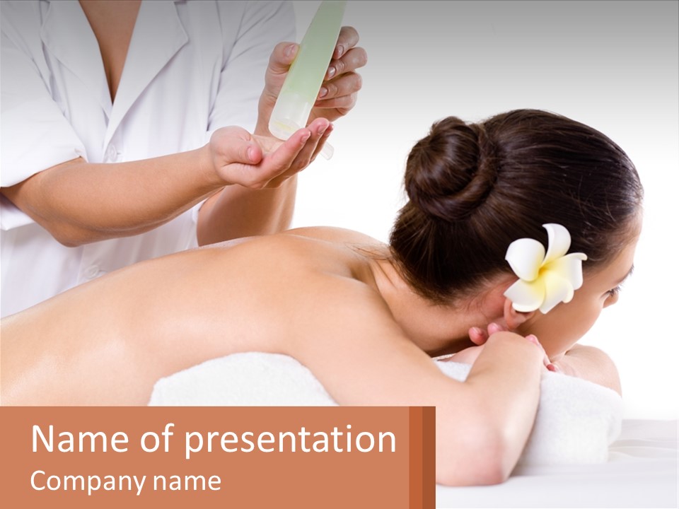 A Woman Getting A Back Massage With A Flower In Her Hair PowerPoint Template