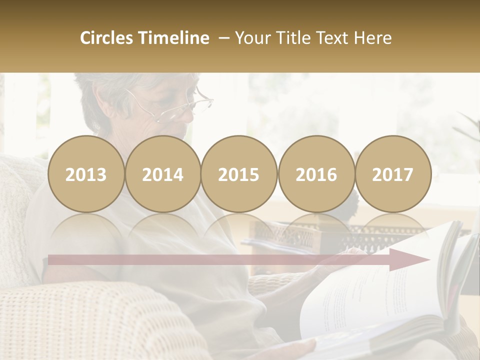 A Woman Sitting On A Couch Reading A Book PowerPoint Template