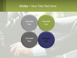 A Man Driving A Car With A Key Chain In His Hand PowerPoint Template