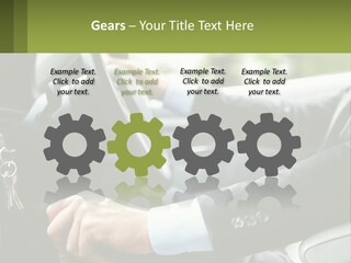 A Man Driving A Car With A Key Chain In His Hand PowerPoint Template