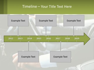 A Man Driving A Car With A Key Chain In His Hand PowerPoint Template