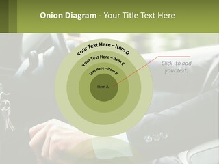 A Man Driving A Car With A Key Chain In His Hand PowerPoint Template