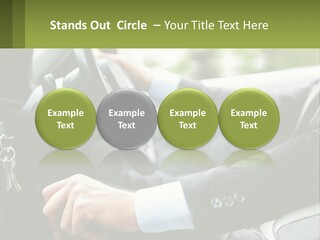 A Man Driving A Car With A Key Chain In His Hand PowerPoint Template