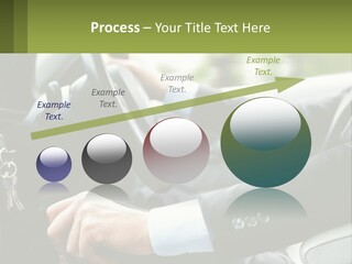 A Man Driving A Car With A Key Chain In His Hand PowerPoint Template