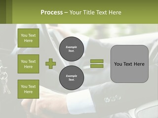 A Man Driving A Car With A Key Chain In His Hand PowerPoint Template
