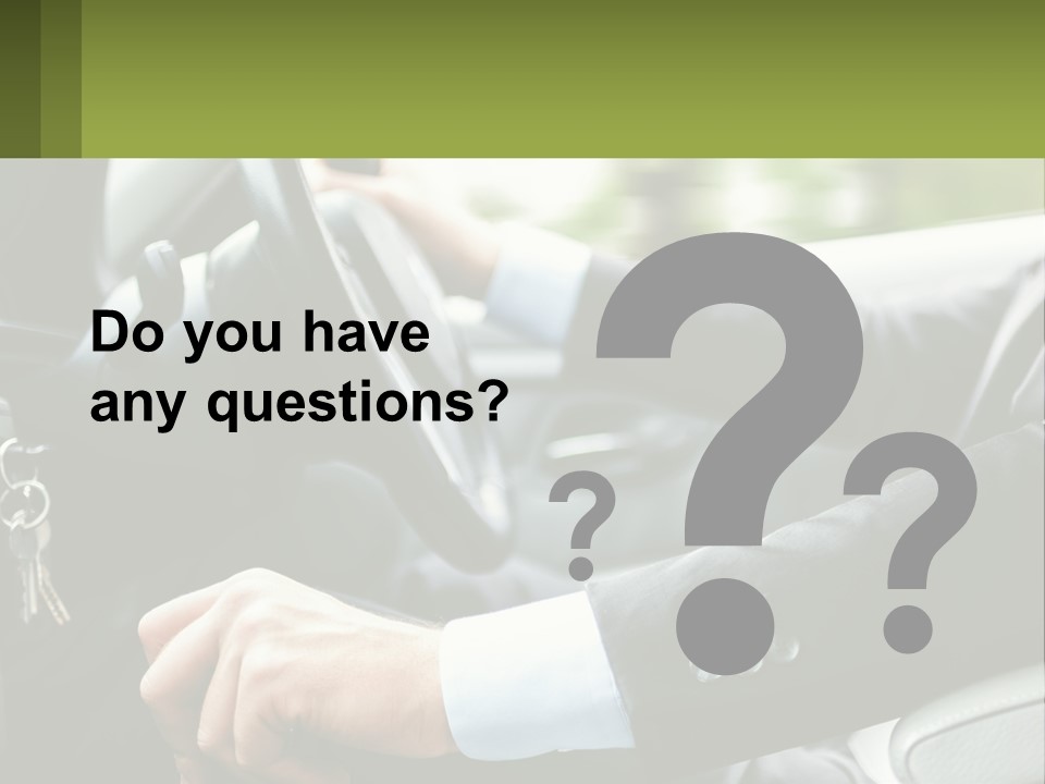 A Man Driving A Car With A Key Chain In His Hand PowerPoint Template