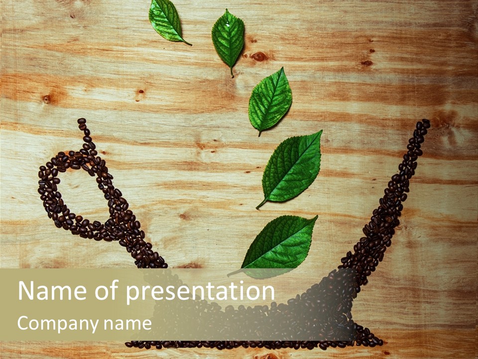 A Wooden Table Topped With Green Leaves And Scissors PowerPoint Template