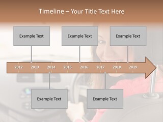 A Woman Driving A Car With A Cell Phone In Her Hand PowerPoint Template
