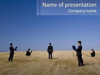 A Group Of People Standing In A Field With Laptops PowerPoint Template