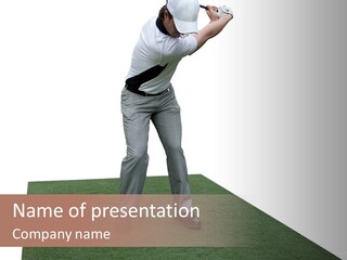 A Man Swinging A Golf Club On Top Of A Green Field PowerPoint Template
