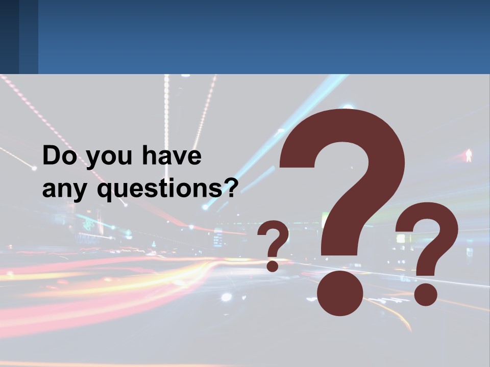 A Blurry Image Of A City Street At Night PowerPoint Template