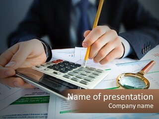 A Person Is Using A Calculator On A Desk PowerPoint Template