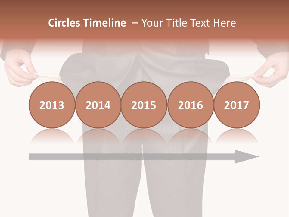 A Man In A Suit Holding A Piece Of Paper PowerPoint Template