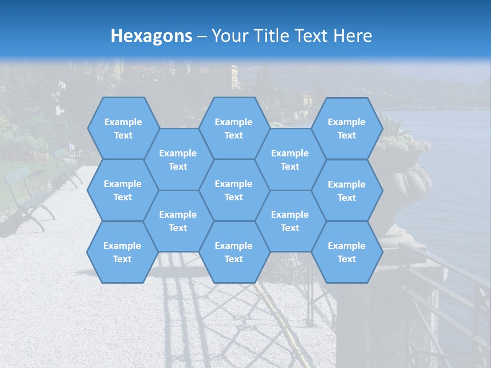 A Stone Walkway Next To A Body Of Water With Mountains In The Background PowerPoint Template