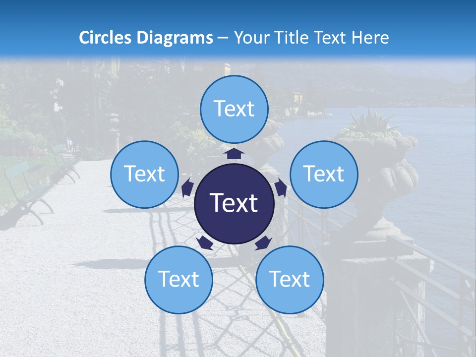 A Stone Walkway Next To A Body Of Water With Mountains In The Background PowerPoint Template