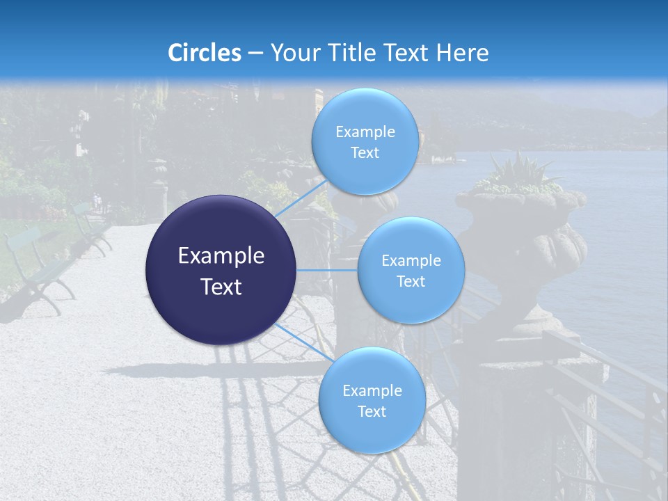 A Stone Walkway Next To A Body Of Water With Mountains In The Background PowerPoint Template