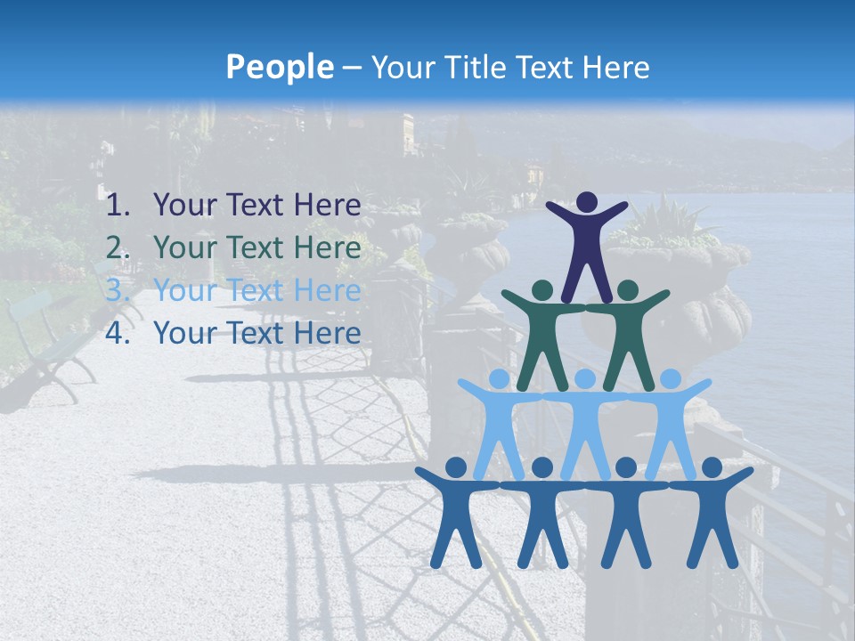 A Stone Walkway Next To A Body Of Water With Mountains In The Background PowerPoint Template