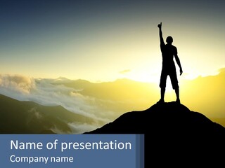 A Man Standing On Top Of A Mountain With His Arms In The Air PowerPoint Template