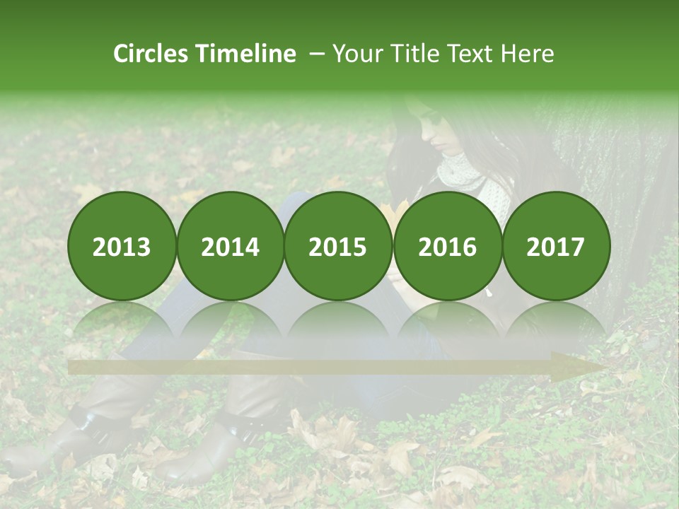 A Woman Sitting Under A Tree Holding A Leaf PowerPoint Template