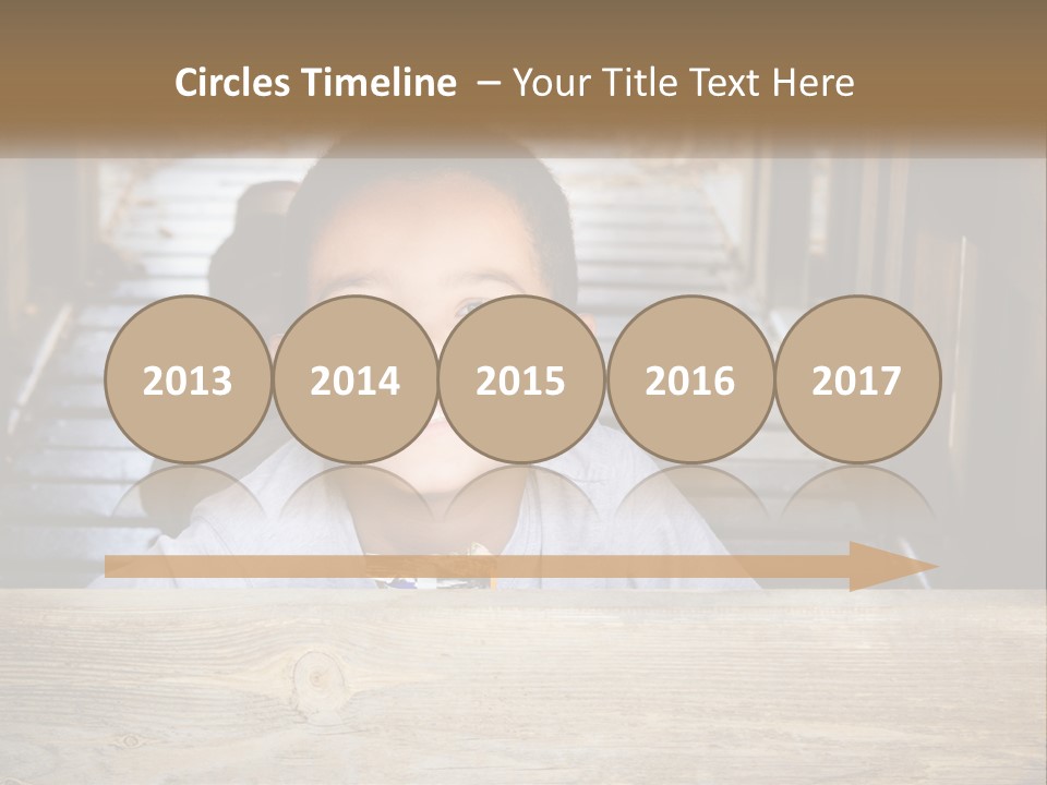 A Young Boy Is Smiling For The Camera PowerPoint Template