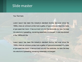 A Large Castle Sitting On Top Of A Lush Green Hillside PowerPoint Template