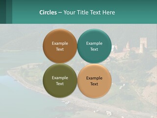 A Large Castle Sitting On Top Of A Lush Green Hillside PowerPoint Template