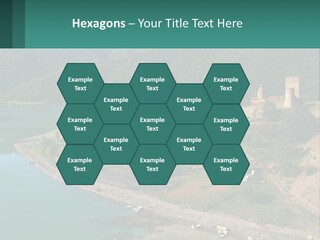 A Large Castle Sitting On Top Of A Lush Green Hillside PowerPoint Template