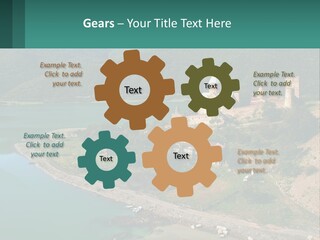 A Large Castle Sitting On Top Of A Lush Green Hillside PowerPoint Template