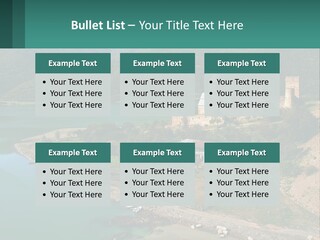 A Large Castle Sitting On Top Of A Lush Green Hillside PowerPoint Template
