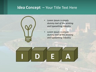 A Large Castle Sitting On Top Of A Lush Green Hillside PowerPoint Template