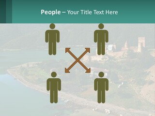 A Large Castle Sitting On Top Of A Lush Green Hillside PowerPoint Template