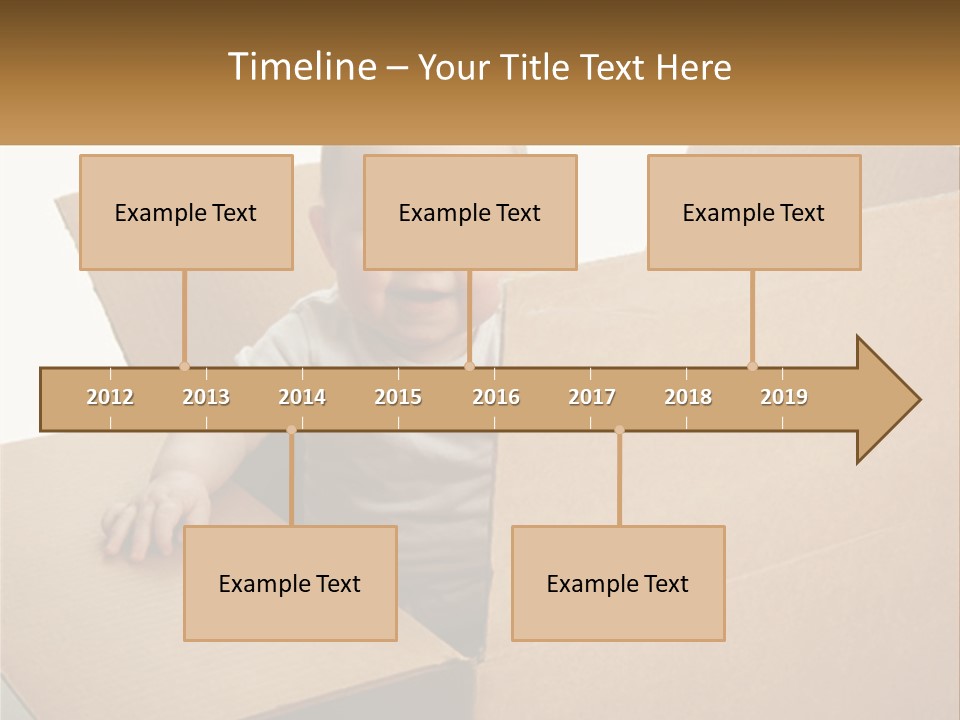 A Baby Sitting In A Cardboard Box With A Smile On His Face PowerPoint Template