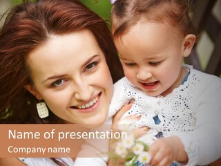 A Woman Holding A Small Child In Her Arms PowerPoint Template