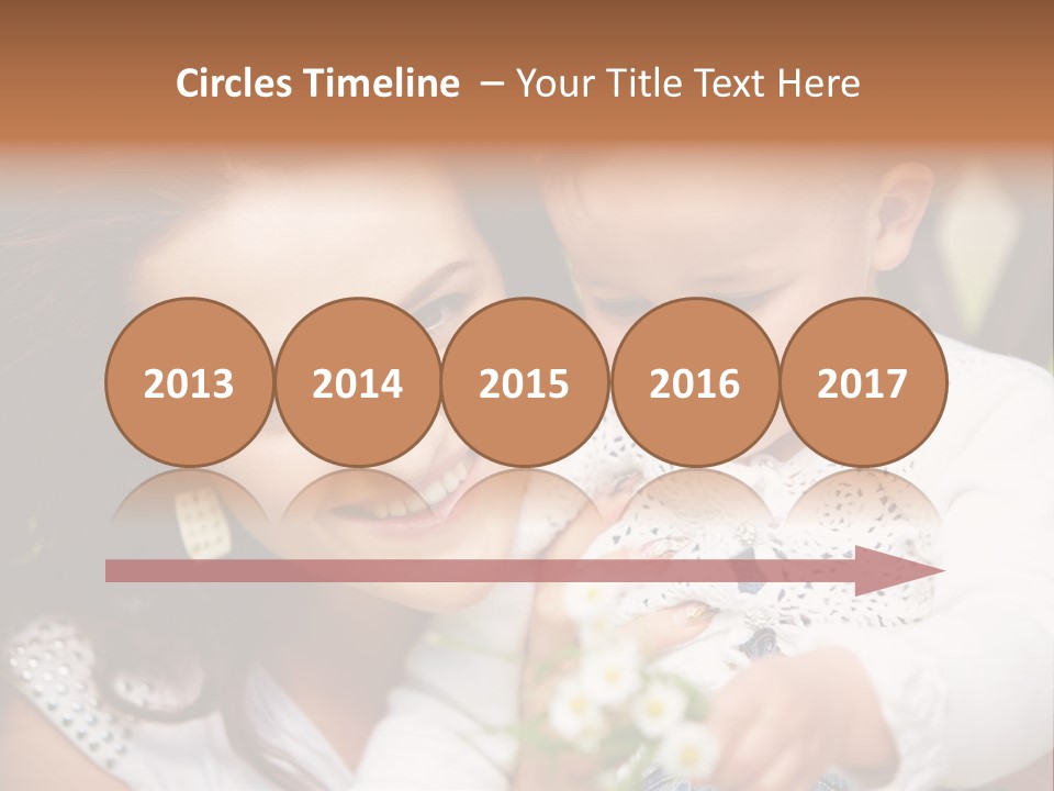 A Woman Holding A Small Child In Her Arms PowerPoint Template